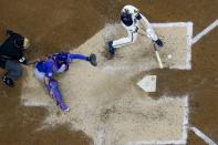 Milwaukee Brewers' Corbin Burnes hits an two-run scoring single during the sixth inning of a baseball game against the Chicago Cubs Wednesday, April 14, 2021, in Milwaukee. (AP Photo/Morry Gash)