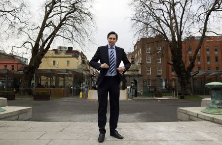 Ireland's Minister of State for Finance Simon Harris poses for a picture in front of Leinster House in Dublin March 5, 2015. REUTERS/Cathal McNaughton