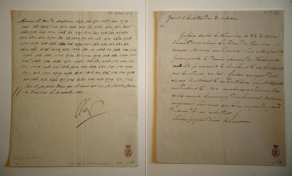 In this photo taken Wednesday, Nov. 28, 2012, a letter dictated and signed by Napoleon in secret code that declares his intentions "to blow up the Kremlin" during his ill-fated Russian campaign is displayed in Fontainebleau, outside Paris. The rare letter, written in unusually emotive language, sees Napoleon complain of harsh conditions and the shortcomings of his grand army. The letter goes on auction Sunday, Dec. 2, 2012. (AP Photo/Christophe Ena)