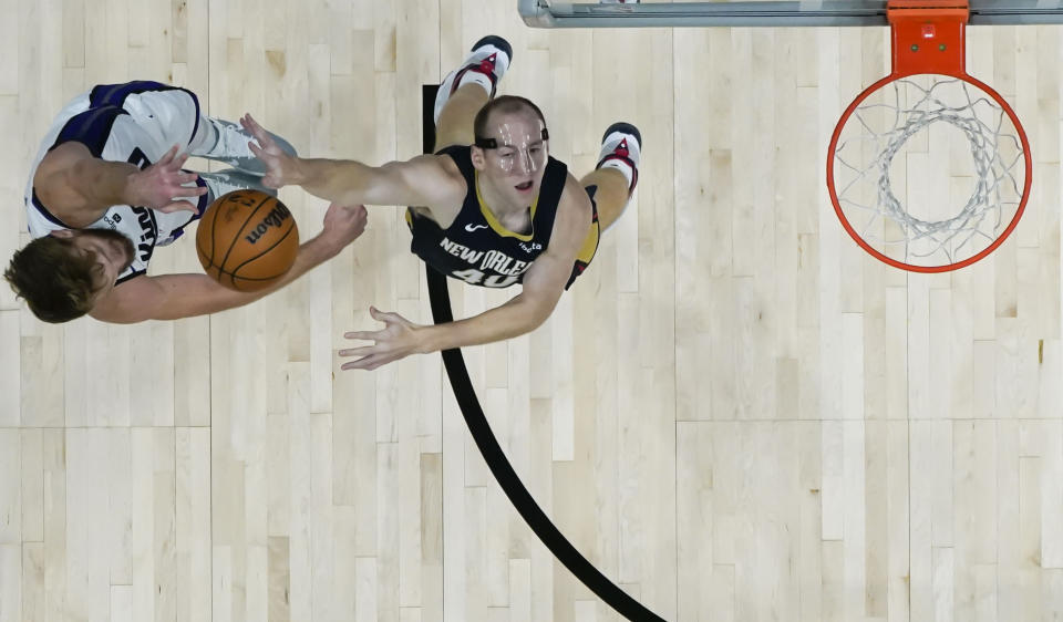 Sacramento Kings forward Domantas Sabonis (10) shoots against New Orleans Pelicans center Cody Zeller in the first half of an NBA basketball game in New Orleans, Wednesday, Nov. 22, 2023. (AP Photo/Gerald Herbert)