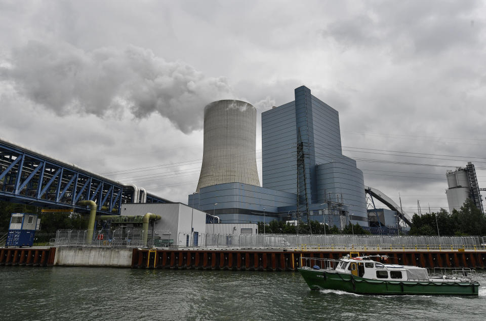 The controversial most modern Uniper Datteln 4 coal-powered plant steams one month after the operational start in Datteln, Germany, Friday, July 3, 2020. The state governors Dietmar Woidke of Brandenburg, Michael Kretschmer of Saxony, Reiner Haseloff of Saxony-Anhalt and Armin Laschet of North Rhine-Westphalia meet in Berlin for the adoption by the Bundestag and Bundesrat of the laws on coal phase-out and structural strengthening in the affected federal states. (AP Photo/Martin Meissner)