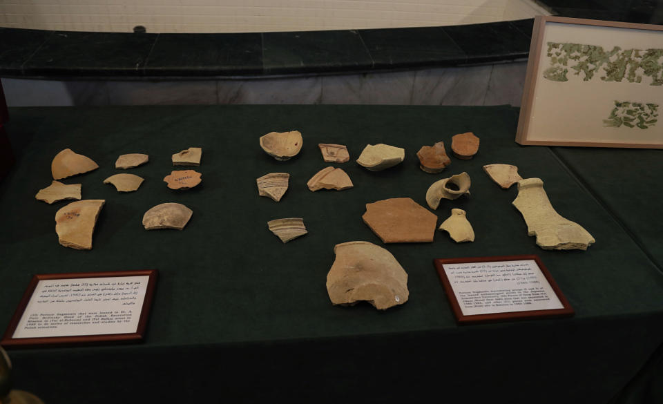 Recently recovered antiquities are displayed at the foreign ministry, in Baghdad, Iraq, Monday, July 29, 2019. The artifacts paraded Monday include archaeological and historical pieces recovered from Britain and Sweden, pottery fragments and shards with writing dating back to the ancient Sumerian civilization. Iraq is putting a great effort to restore its lost rich cultural heritage after it was decimated during the chaos that followed the 2003 U.S. invasion. (AP Photo/Hadi Mizban)