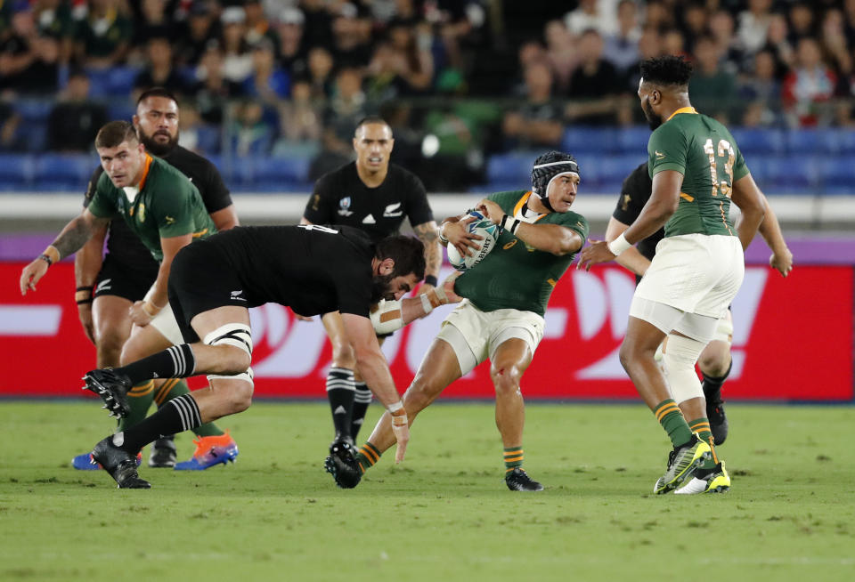 South Africa's Cheslin Kolbe avoids a tackle during the Rugby World Cup Pool B game between New Zealand and South Africa in Yokohama, Japan, Saturday, Sept. 21, 2019. (AP Photo/Shuji Kajiyama)