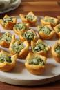 <p>Your favorite dip, now in adorable, bite-size form.</p><p>Get the recipe from <a href="https://www.delish.com/cooking/recipe-ideas/recipes/a50688/spinach-artichoke-cups-recipe/" rel="nofollow noopener" target="_blank" data-ylk="slk:Delish;elm:context_link;itc:0;sec:content-canvas" class="link ">Delish</a>.</p>