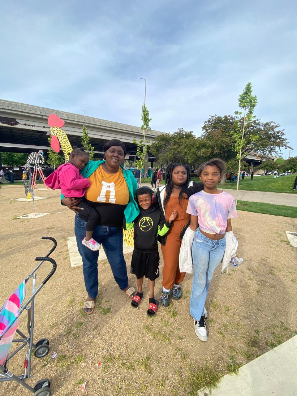 Danielle Farris and her children enjoy the sights of Thunder Over Louisville from the Meijer Family Fun Zone on Saturday, April 20, 2024.