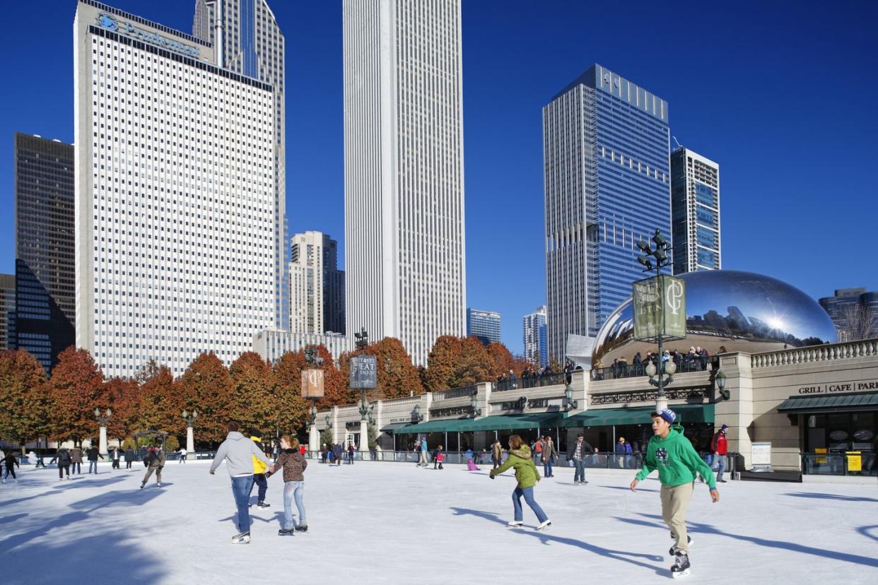 people ice skating in a city