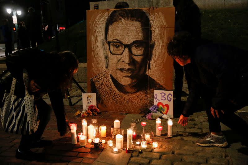 The late U.S. Supreme Court Justice Ruth Bader Ginsburg is mourned during a vigil in Monument Square in Portland, Maine