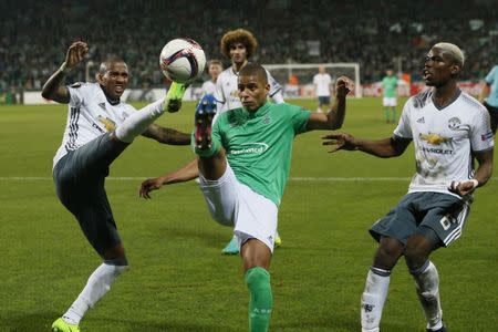 Soccer Football - Saint-Etienne v Manchester United - UEFA Europa League Round of 32 Second Leg - Stade Geoffroy-Guichard, Saint-Etienne, France - 22/2/17 Manchester United's Ashley Young in action with St Etienne's Kevin Monnet-Paquet Action Images via Reuters / Andrew Boyers Livepic