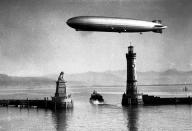 <p>German zeppelin the “Hindenburg” making a test flight in 1936. (Popperfoto/Getty Images) </p>