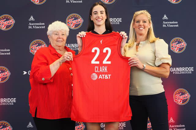 <p>Ron Hoskins/NBAE/Getty</p> Caitlin Clark of the Indiana Fever poses for a photo with Lin Dunn and Christie Sides.