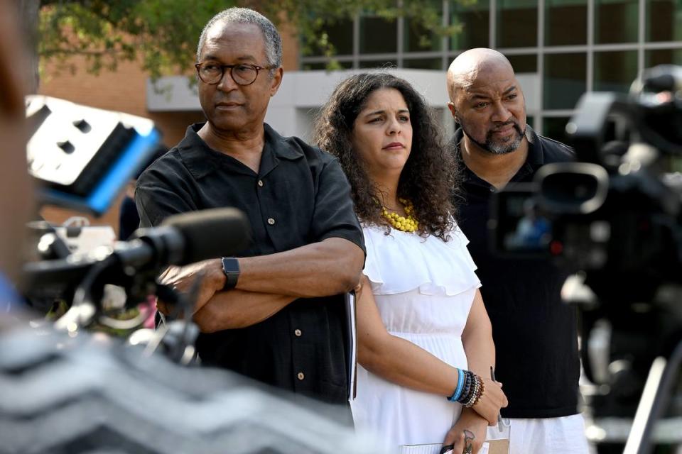 Glenn Pearson of the Manatee County Black Caucus, Evelyn Almodovar of the Manatee County Democratic Party and Orlando Pickens during a press conference at the Manatee County Historic Courthouse Friday. The press conference was organized by the Manatee County Democratic Party to protest the recently passed immigration bill SB 1718.