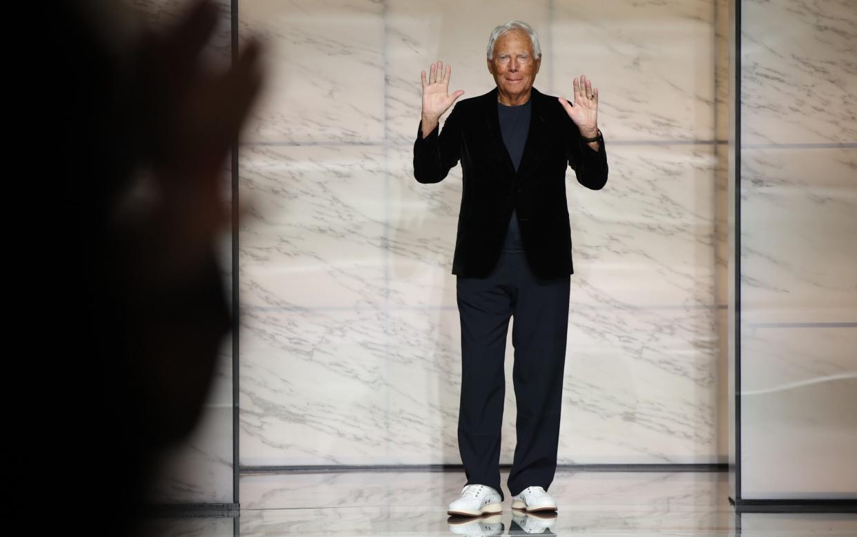 Giorgio Armani walks the runway at a fashion show in Milan last year