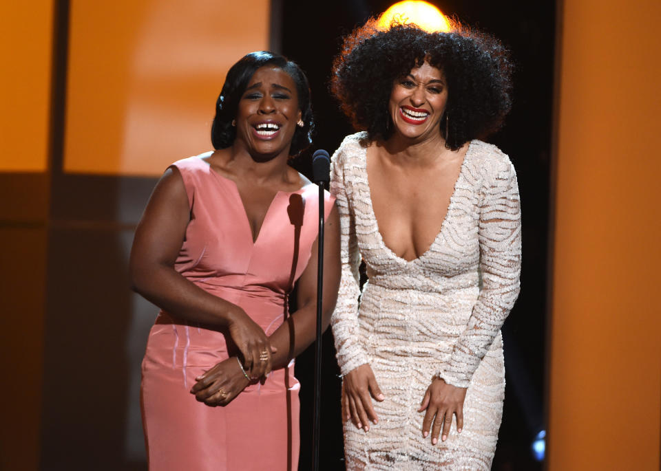 Uzo Aduba, left, and Tracee Ellis Ross present the award for outstanding actor in a comedy series on stage at the 46th NAACP Image Awards at the Pasadena Civic Auditorium on Friday, Feb. 6, 2015, in Pasadena, Calif. (Photo by Chris Pizzello/Invision/AP)