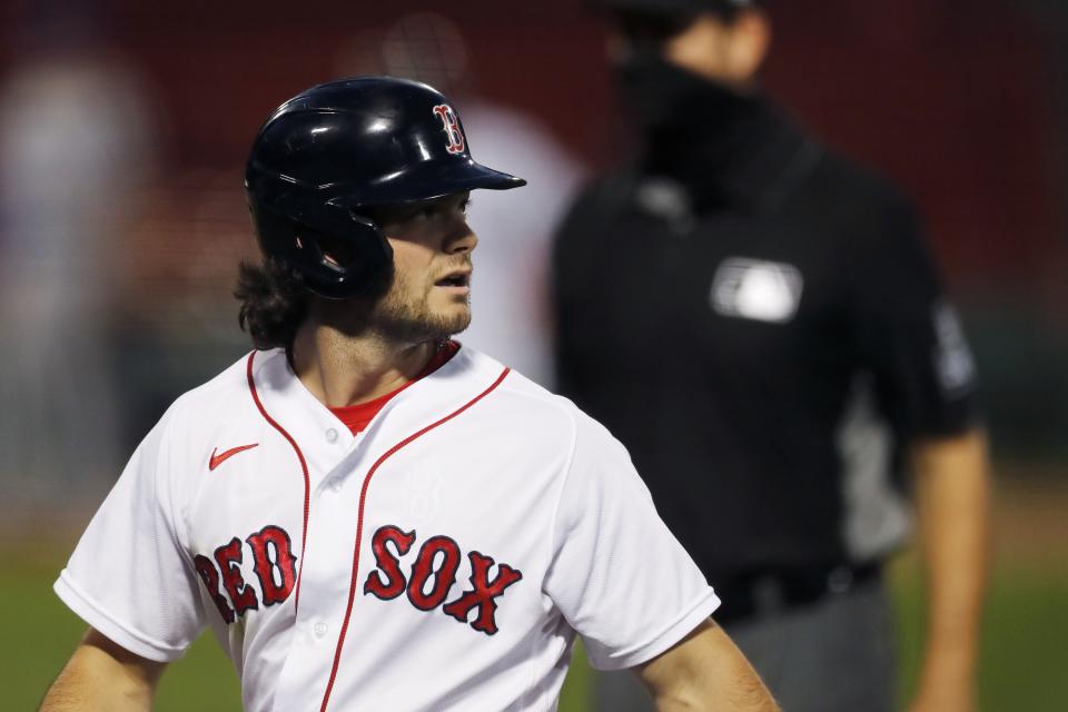 Boston Red Sox's Andrew Benintendi walks back to the dug out after grounding into a double play during the second inning of a baseball game against the Toronto Blue Jays, Saturday, Aug. 8, 2020, in Boston. (AP Photo/Michael Dwyer)