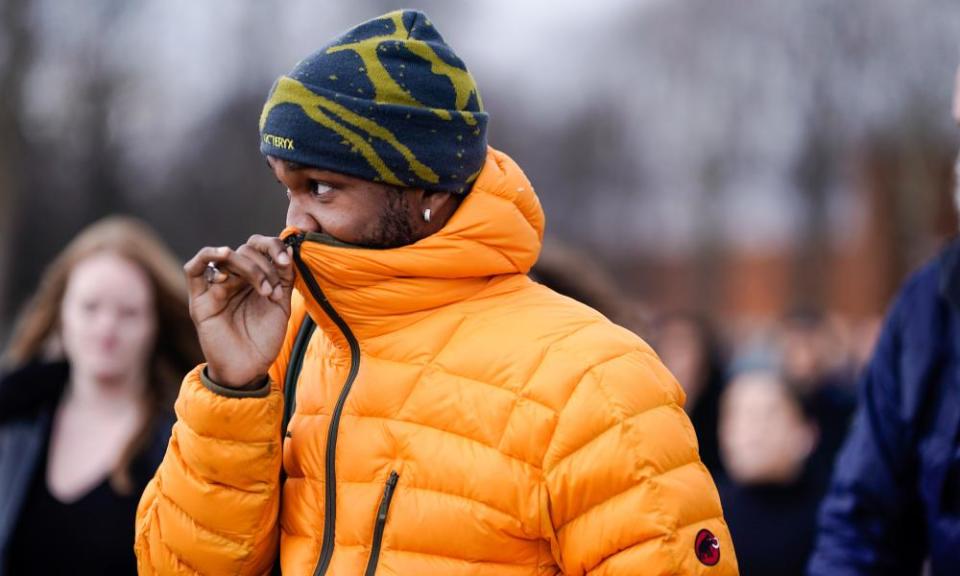 Frank Ocean wears a Mammut orange puffer jacket and an Arc’Teryx beanie hat in Paris.