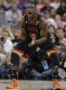 Mercer guard Ike Nwamu (10) celebrates during the first half of an NCAA college basketball second-round game against Duke, Friday, March 21, 2014, in Raleigh, N.C. (AP Photo/Chuck Burton)