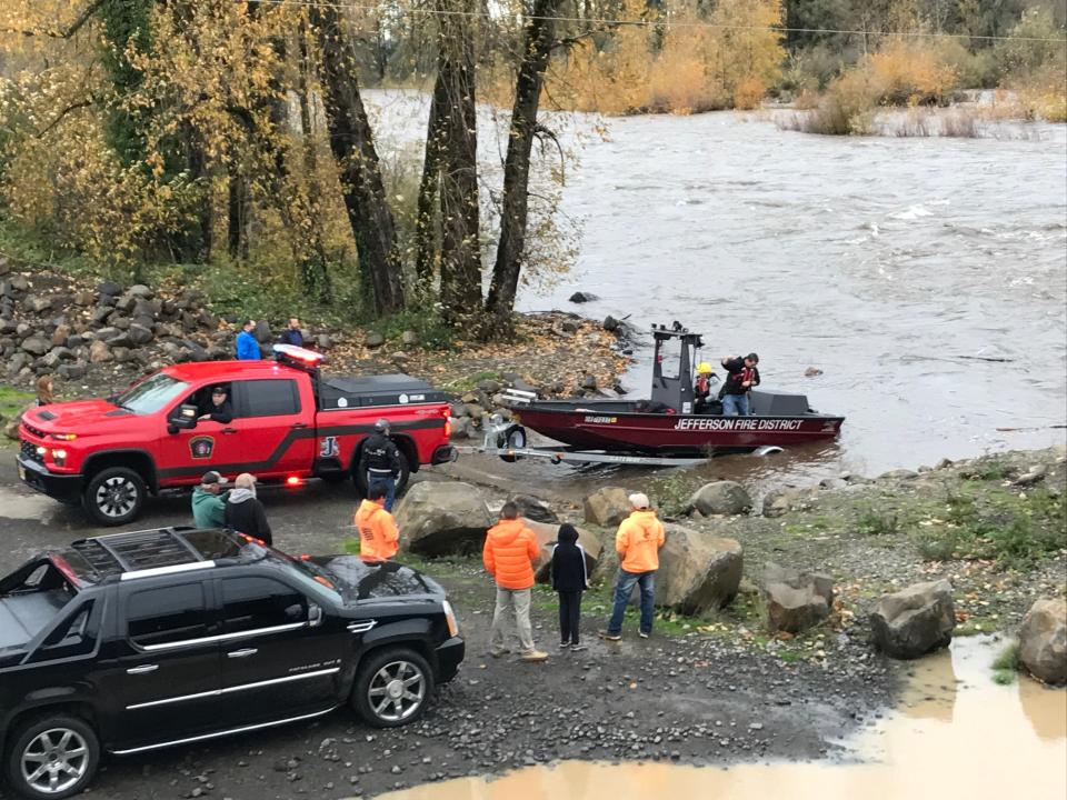 Multiple police and fire crews rescued a 32-year-old woman caught in a current in the Santiam River Thursday near the 1st Street bridge in Stayton.