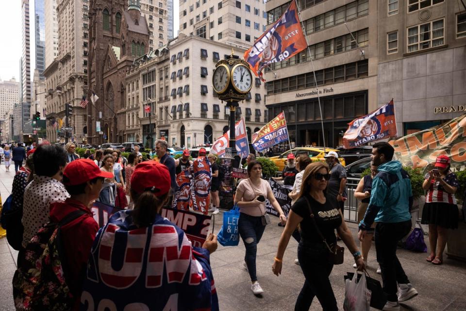 A clock outside Trump Tower in New York City, seen during a protest in support of the former president in June 2023 (AFP via Getty Images)