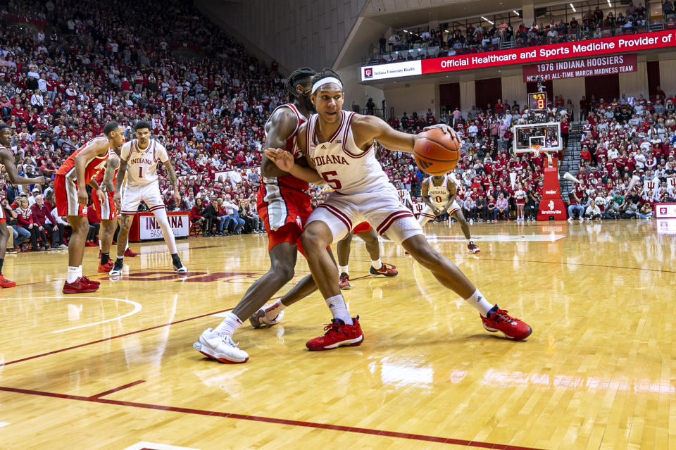 Indiana forward Malik Reneau (5) works the ball into the Ohio State defense during the second half of an NCAA college basketball game Saturday, Jan. 6, 2024, in Bloomington, Ind. (AP Photo/Doug McSchooler)