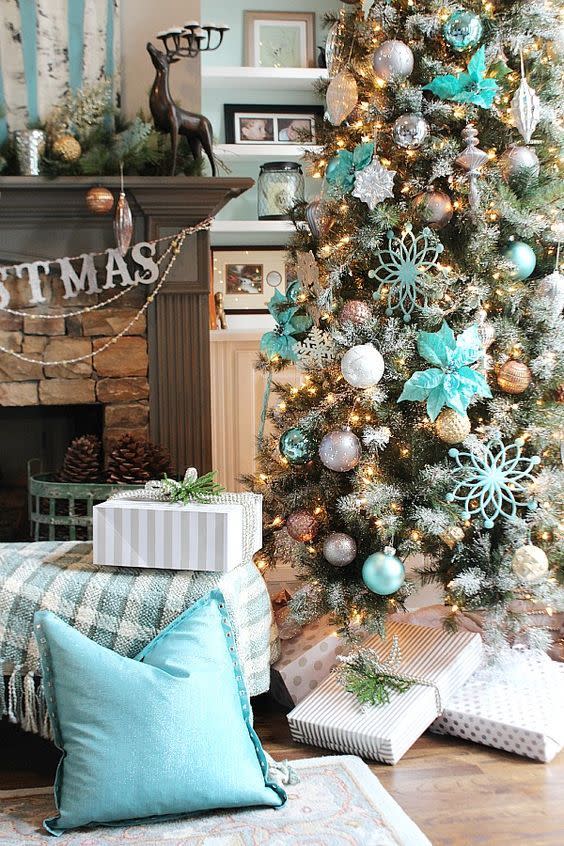 <p>Icy blue Christmas decor with touches of silver, gray, and gold make this Christmas tree a dazzling one. </p><p><strong>Get the tutorial at <a href="http://refreshrestyle.com/christmas-tree-ideas-12-bloggers-christmas-balsam-hill/" rel="nofollow noopener" target="_blank" data-ylk="slk:Refresh Restyle;elm:context_link;itc:0;sec:content-canvas" class="link ">Refresh Restyle</a>. </strong></p><p><a class="link " href="https://www.amazon.com/AMS-Christmas-Shatterproof-Decorations-Hand-Help/dp/B073B62FRT/ref=sr_1_2?dchild=1&keywords=turquoise+christmas+decorations&qid=1631894075&s=home-garden&sr=1-2&tag=syn-yahoo-20&ascsubtag=%5Bartid%7C10050.g.1251%5Bsrc%7Cyahoo-us" rel="nofollow noopener" target="_blank" data-ylk="slk:SHOP BLUE ORNAMENTS;elm:context_link;itc:0;sec:content-canvas">SHOP BLUE ORNAMENTS</a></p>