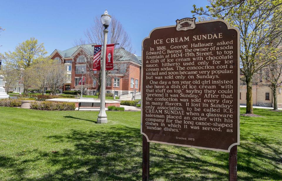 A historical marker, erected near Two Rivers city hall recalls the development of the Sundae in the city during the 1880s, Saturday, May 8, 2021, in Two Rivers, Wis.