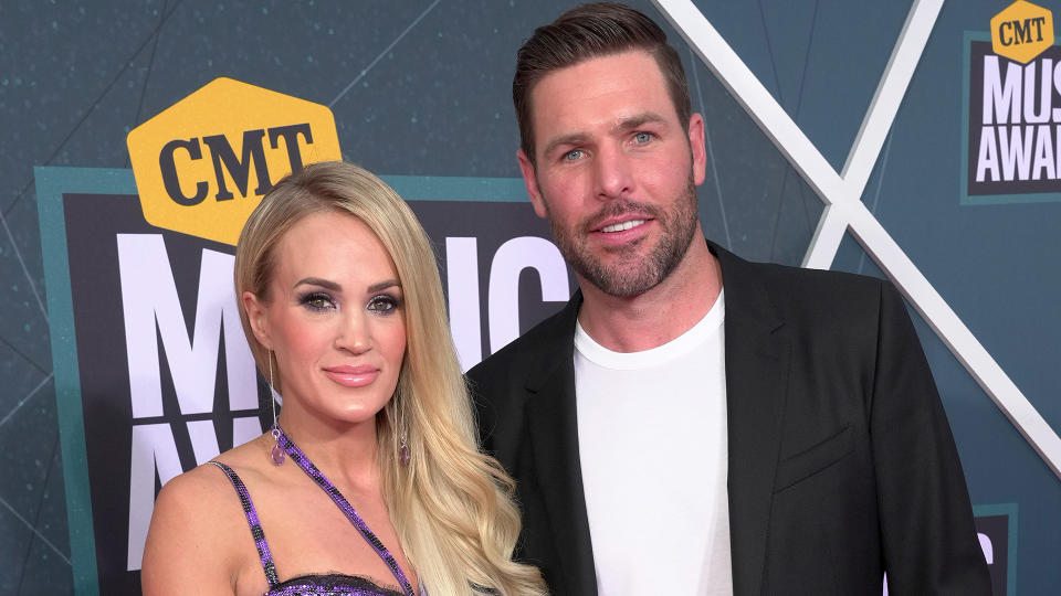 Carrie Underwood and former NHL player Mike Fisher attend the 2022 CMT Music Awards. (Photo by Kevin Mazur/Getty Images for CMT)