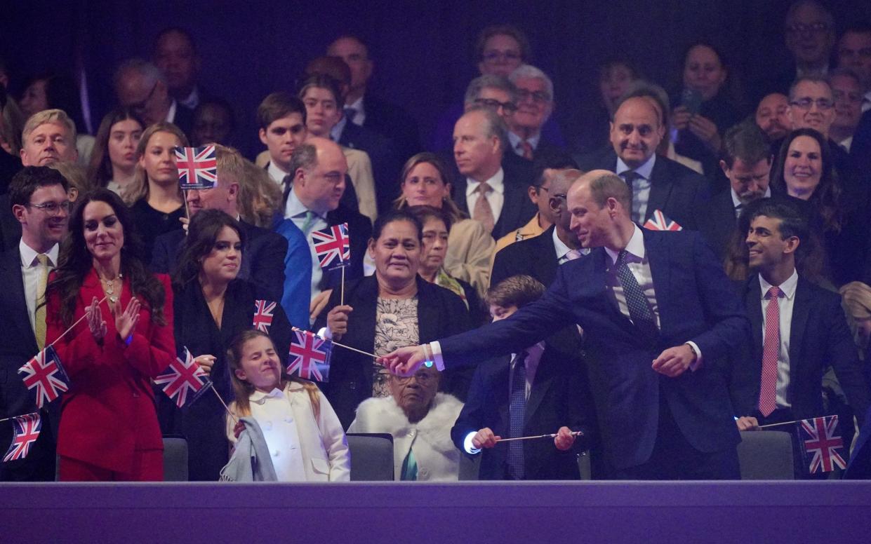 Prince William waves his Union flag in their faces. - Yui Mok/PA