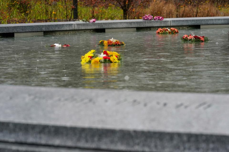 Flowers adorn a memorial to the victims of the Sandy Hook Elementary School shooting, in Newtown, Conn., Sunday, Nov. 13, 2022. (AP Photo/Bryan Woolston)