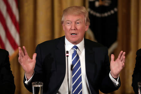 FILE PHOTO: U.S. President Donald Trump attends a meeting with U.S. House Deputy Whip team at the East room of the White House in Washington, U.S. March 7, 2017. REUTERS/Carlos Barria/File Photo