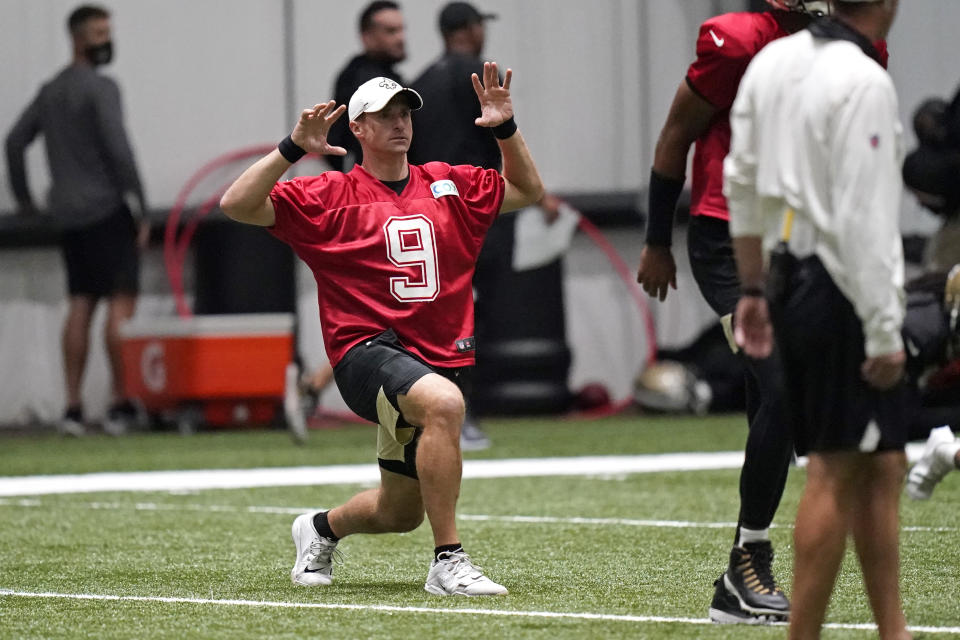 New Orleans Saints quarterback Drew Brees (9) stretches during practice at their NFL football training facility in Metairie, La., Wednesday, Sept. 2, 2020. (AP Photo/Gerald Herbert, Pool)