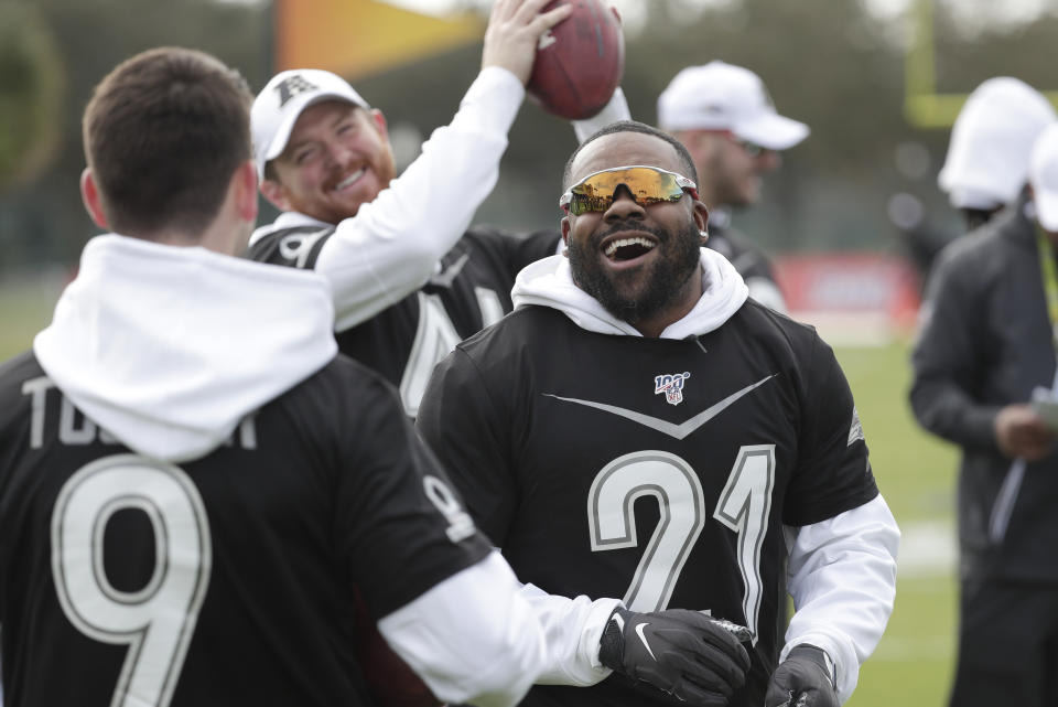 Baltimore Ravens kicker Justin Tucker (9), long snapper Morgan Cox, center, and running back Mark Ingram joke around during an NFC practice for the NFL Pro Bowl football game Wednesday, Jan. 22, 2020, in Kissimmee, Fla. (AP Photo/John Raoux)