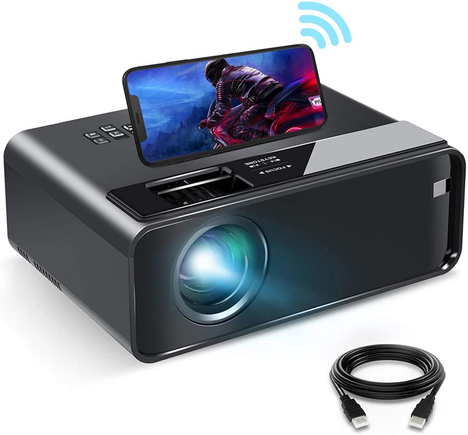 Smartphone sits on Elephas Mini-Projector