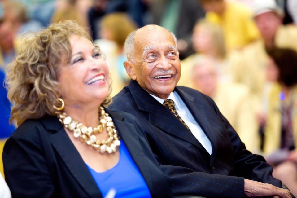 The late Eliot Battle and his daughter, Muriel Jean Battle Browder, listen to speakers at the dedication of Muriel Williams Battle High School. The school was named after Battle’s wife, who died in 2003.