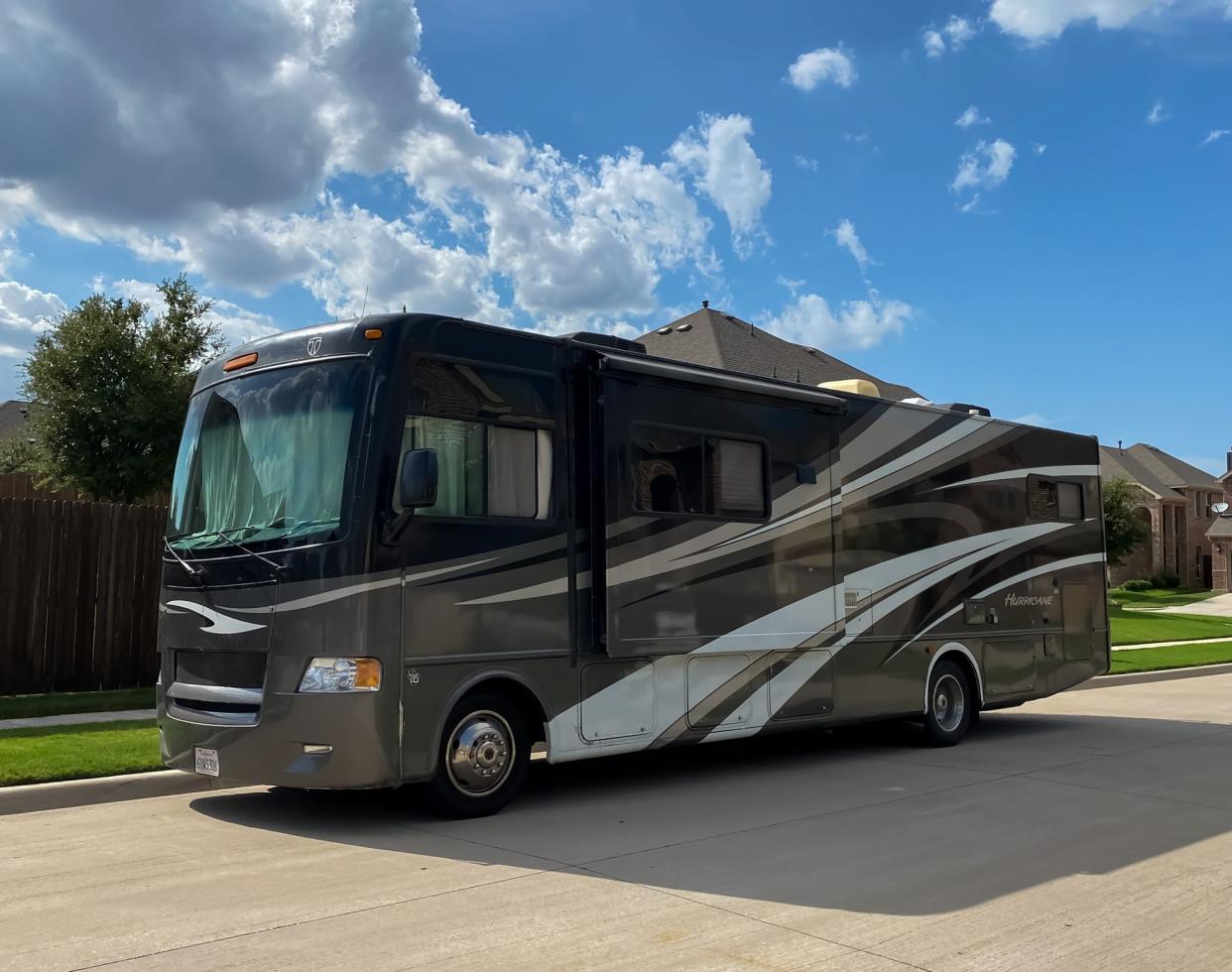 Mckinney, TX / USA - August 10, 2020: front view of hurricane motorhome recreational vehicle (RV) with blue sky in the afternoon