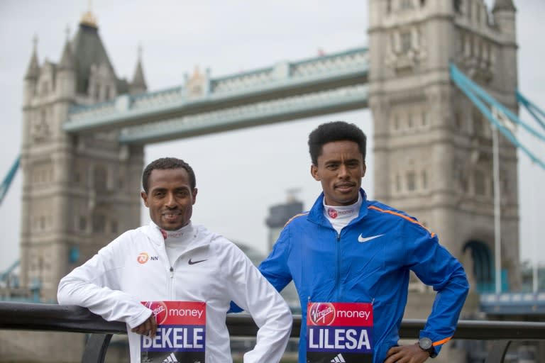 Ethiopian elite runners, Kenenisa Bekele (L) and Feyisa Lilesa pose during a photocall ahead of the London Marathon, Bekele is hoping to set a new record time