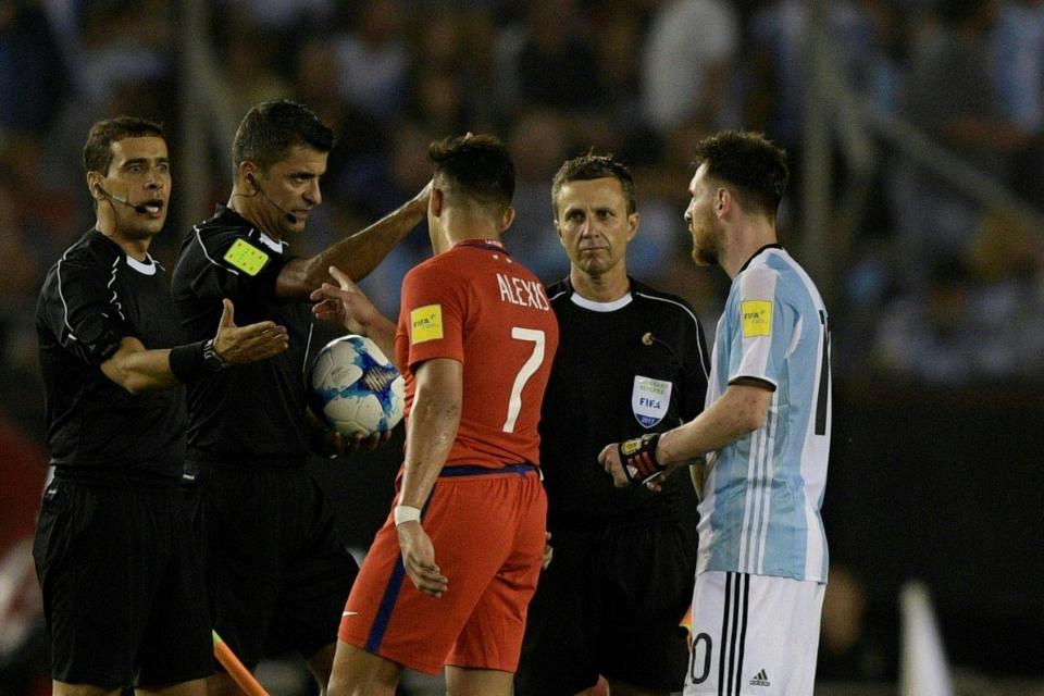 Messi and Arsenal's Alexis Sanchez speak to the officials after Argentina's win: AFP/Getty Images