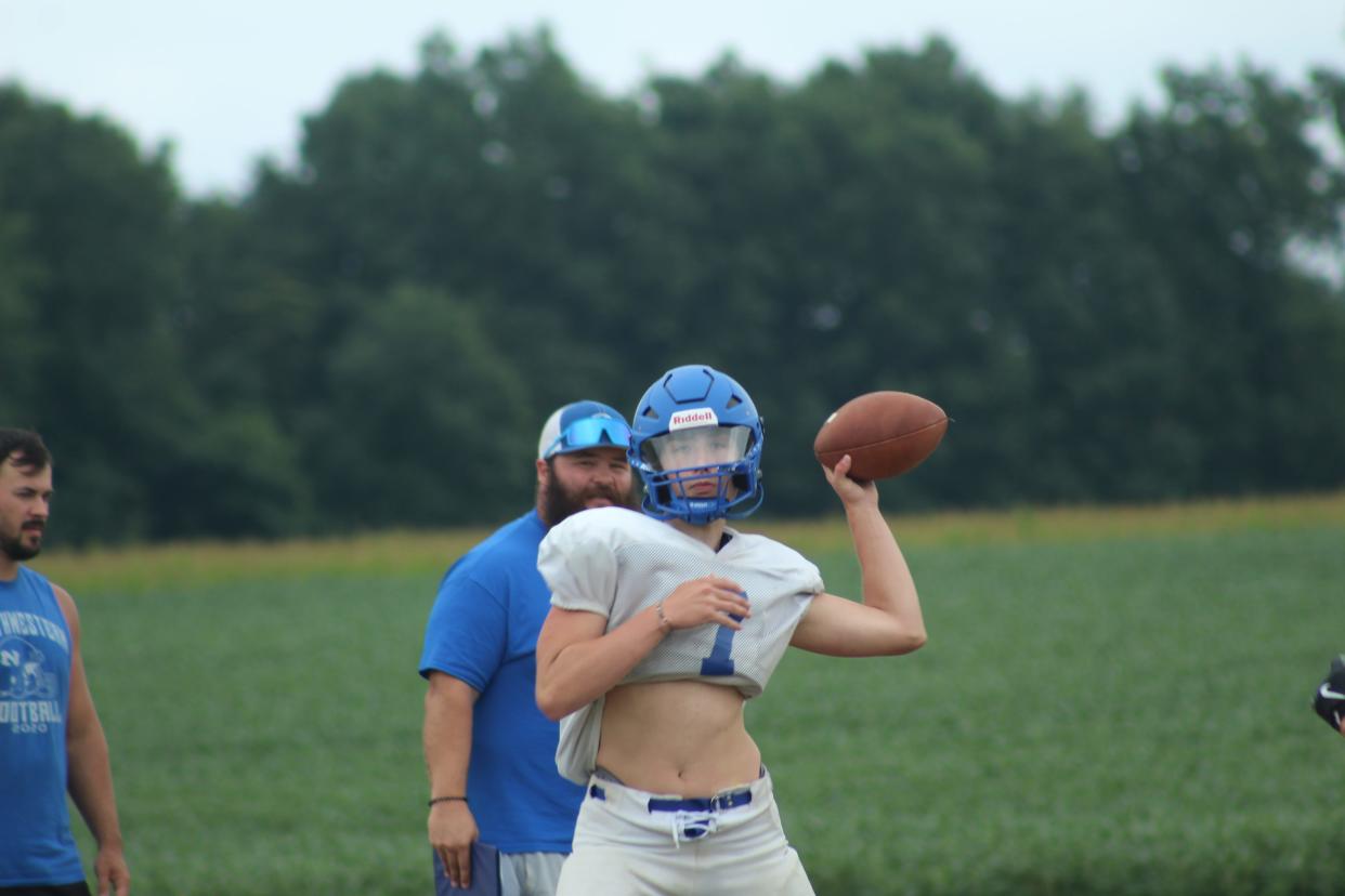 Northwestern quarterback Isaac Beun throws a pass during practice.