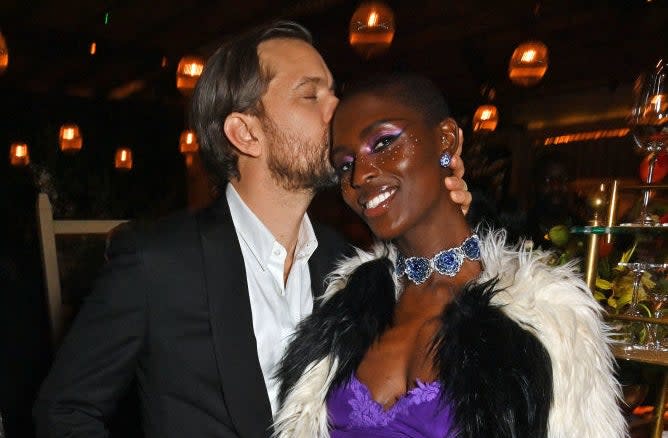 Joshua kissing Jodie on the temple at an event