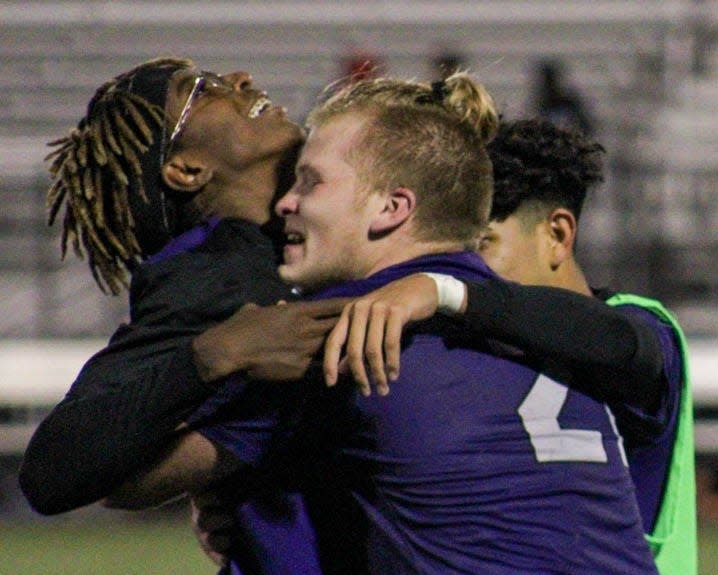 East Stroudsburg South's Aaron Juszynski (right) hugs teammate Jony Klu (left) after Klu scored the game-winning goal against Saucon Valley in East Stroudsburg on Thursday, Oct. 28, 2021. South won the District 11 Class 3A quarterfinals 3-2 in extra time.