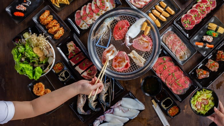 yakiniku spread with assorted meats and sides 