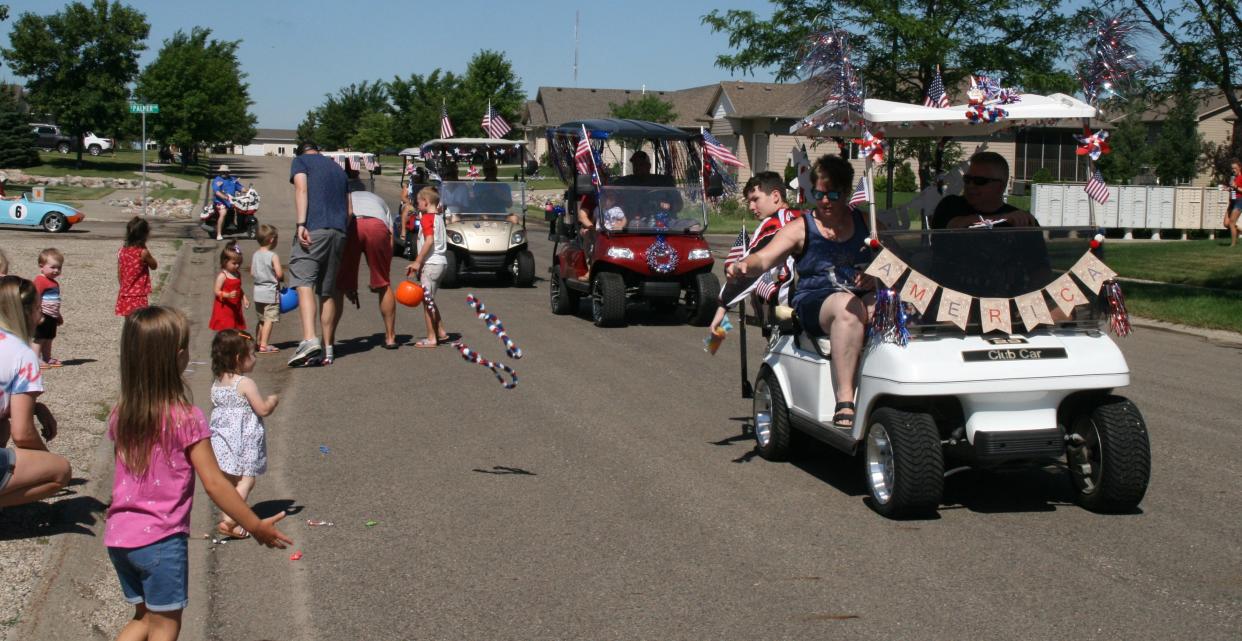 Candy, necklaces and bracelets were tossed out to those who watched the Independence Day parade through the Rolling Hills Subdivision near Rolling Hills Golf Club Monday morning.