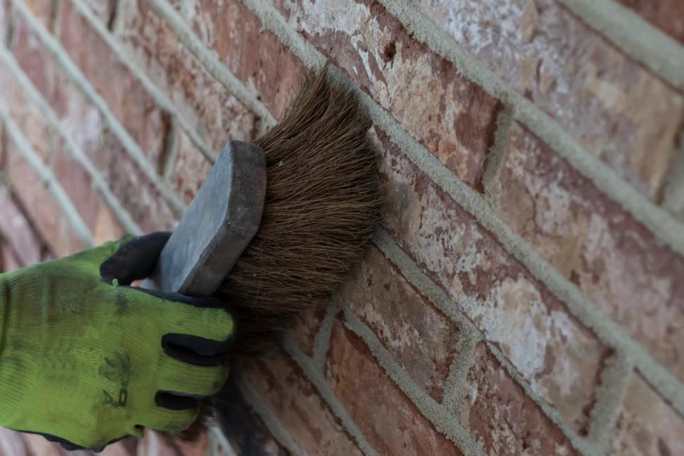 Using brush on brick wall