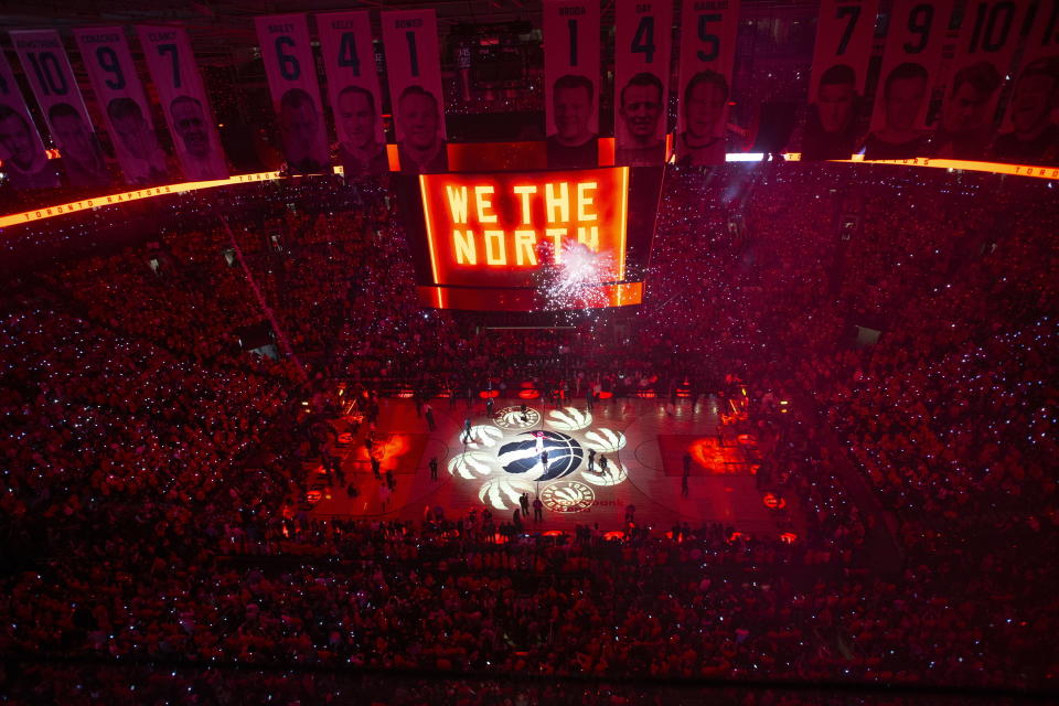 FILE - In this June 2, 2019, file photo, the court is illuminated at Scotiabank Arena ahead of the first half of Game 2 of the NBA Finals between the Toronto Raptors and the Golden State Warriors in Toronto. The Canadian government has denied a request by the NBA and the Raptors to play in Toronto amid the pandemic. An official familiar with the federal government’s decision told The Associated Press on Friday, Nov. 20, 2020, there is too much COVID-19 circulating in the United States to allow for cross-border travel that is not essential. (Chris Young/The Canadian Press via AP, File)