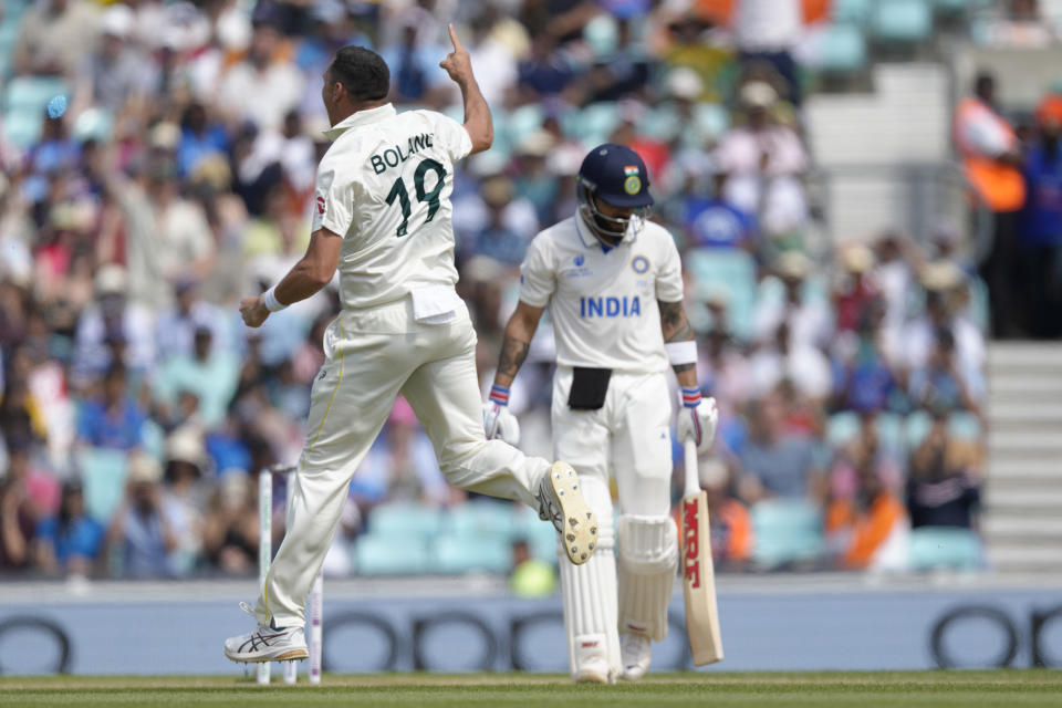 Australia's Scott Boland celebrates taking the wicket of India's Virat Kohli caught by Australia's Steven Smith on the fifth day of the ICC World Test Championship Final between India and Australia at The Oval cricket ground in London, Sunday, June 11, 2023. (AP Photo/Kirsty Wigglesworth)