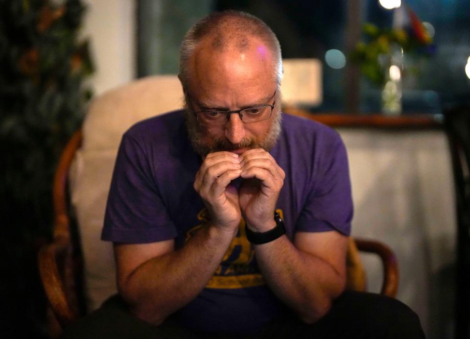 Johnston school board candidate Jason Arnold watches the poll numbers during an election night watch party at Pots and Shots in West Des Moines on Thursday.