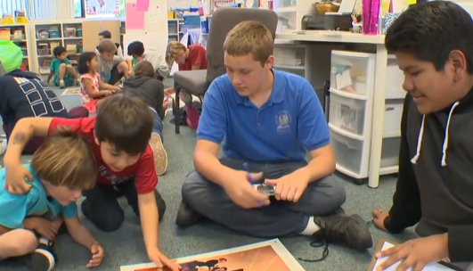 Students at one of the San Diego area’s JCS hybrid charter schools work together. The schools grew out of a program that met in a barn northeast of the city with 400 students, most of them homeschoolers. (Courtesy of Jennifer Cauzza)