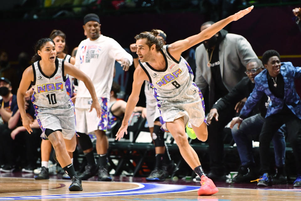 Feb 18, 2022; Cleveland, OH, USA;  Gianmarco Tamberi, Italian high jump Olympic champion, of Team Nique celebrates after a dunk during the first half of the Ruffles NBA All-Star Celebrity Game at the Wolstein Center. Mandatory Credit: Ken Blaze-USA TODAY Sports