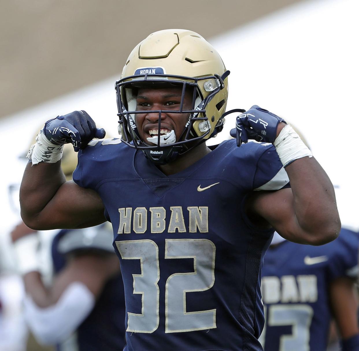 Hoban running back Lamar Sperling flexes after his 89-yard touchdown run in the second half against Iona Prep, Saturday, Sept. 3, 2022.