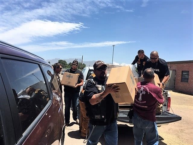 Volunteers unload non-perishable meals donated by Pack Away Hunger at the former U.S. Army Reserve Center in Las Cruces, where migrants released from federal custody are being processed. Friday, May 17, 2019.