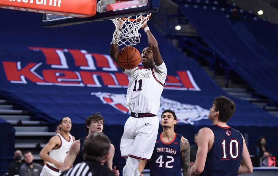 Gonzaga guard Joel Ayayi (11) dunks the ball against Saint Mary's during the second half of their game at McCarthey Athletic Center.